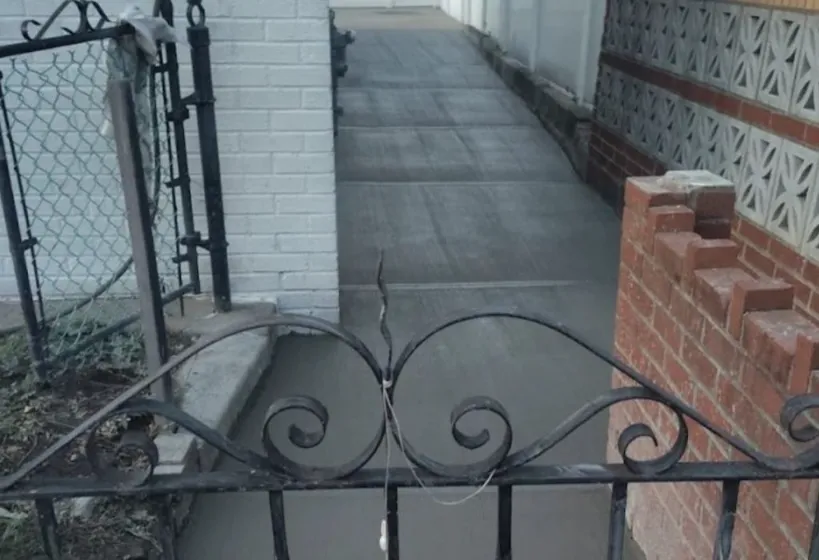 Concrete sidewalk in NYC, reflecting the city's iconic streetscape with a durable and well-maintained surface.